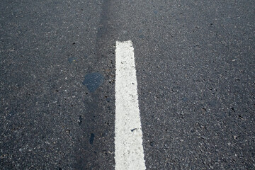 White traffic lane marking on a street in Rio de Janeiro.