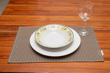 Plates, cups and cutlery on a breakfast table in Rio de Janeiro.