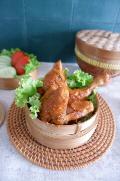 Roasted Spiced Chicken with Coconut Milk as Ayam Percik in preparation for iftar during the fasting month of Ramadan