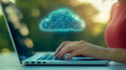 Businesswoman working remotely on a laptop with cloud computing technology displayed on screen.