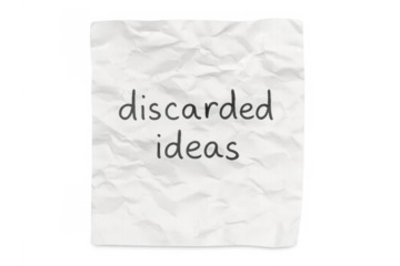 Crumpled paper with discarded ideas text representing failed concepts and creative process waste