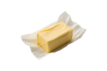Creamy yellow butter block wrapped in parchment paper isolated on transparent background
