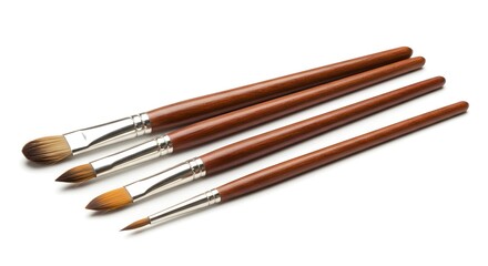 Fototapeta premium Artist's paintbrushes set with brown handles in various sizes, isolated on a white background. Essential tools for painting and creative art.