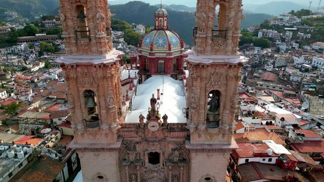 Overhead aerial of Santa Prisca's dome and town architecture in the historic center of Taxco, Guerrero