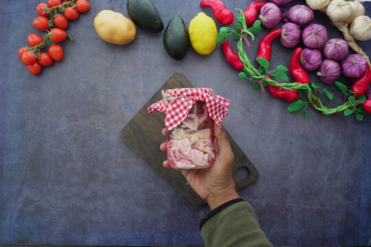 Fresh vegetables and homemade pickles on a kitchen counter - Powered by Adobe
