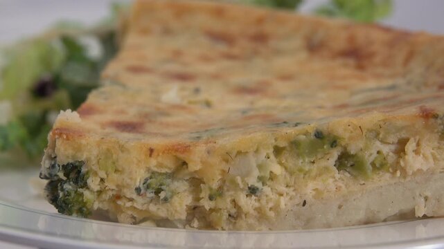 A savory broccoli quiche delight featuring fresh broccoli florets baked into a creamy egg filling creating a wholesome flavorful dish perfect for breakfast brunch or anytime enjoyment