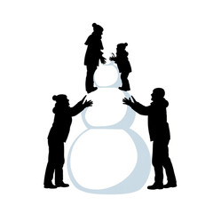Silhouette of a family building a large snowman together.
