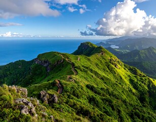 Lush green mountain range meets turquoise ocean