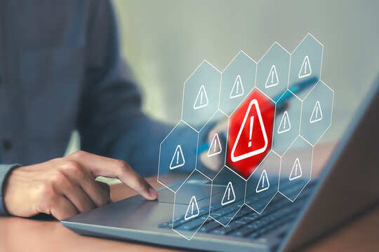 Cybersecurity concept shows warning symbols on screen, system malfunctions and threat detection technology.
