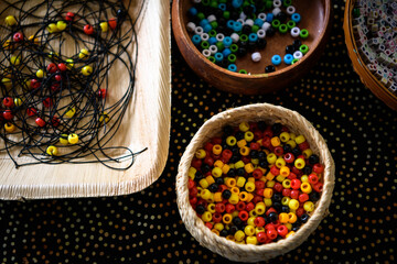 Indigenous craft - bracelet making with beads - horizontal