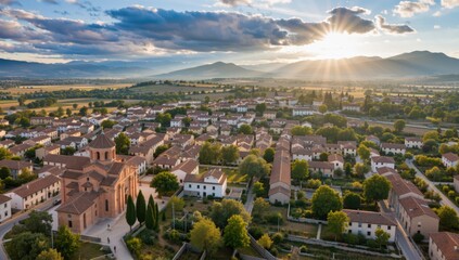 Aerial view of the town of venzone in friuli venezia giulia, italy, at sunset with sun rays