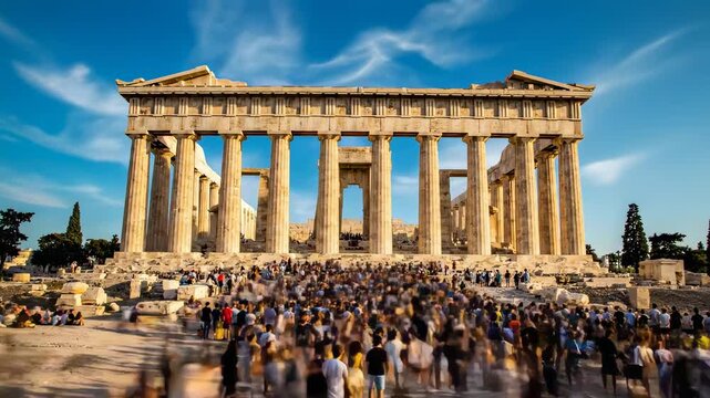 The Majestic Parthenon in Athens, Greece, Under a Bright Blue Sky with Crowds of Tourists.