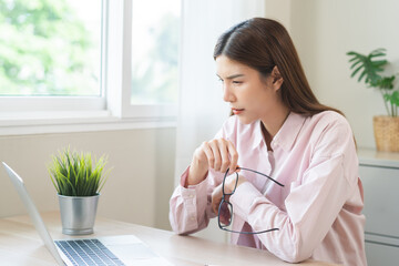 Eye problem concept, fatigue asian young woman tired eyes, irritated rubbing nose, relief vision...