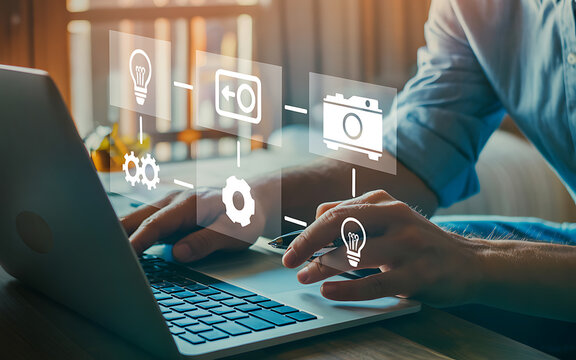 Person using a laptop with digital icons representing ideas, workflow, and technology, symbolizing innovation and digital transformation in business