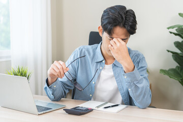 Eye problem concept, fatigue asian young man, male tired eyes, irritated rubbing nose, relief...