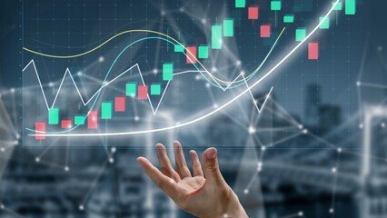 This image features a hand reaching toward financial charts that depict market growth trends and data analytics, symbolizing insight and potential success in business. Copula
