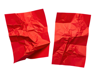 Two irregularly-shaped, crumpled sheets of bright red paper on a black background