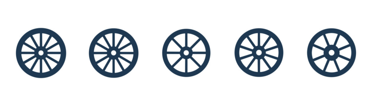 Set of old classic wooden wagon wheels. Farm cart wheel collection