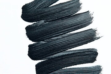 Abstract Black Paint Strokes on White Background Expressing Texture and Artistic Movement