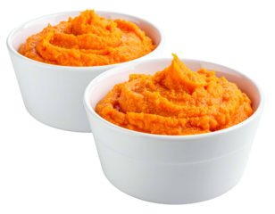 Two servings of creamy orange puree in white bowls