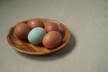 Duck and chicken eggs in a basket