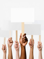 Multiple hands holding blank protest signs isolated on white background