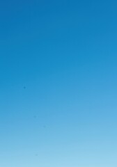 A vast, clear blue sky stretching endlessly, perfect for copy space or as a bright, optimistic backdrop, symbolizing freedom and clarity ,above ,weather ,atmosphere