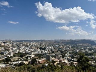 Obraz premium Panoramic cityscape of Al Baha, Saudi Arabia under blue sky