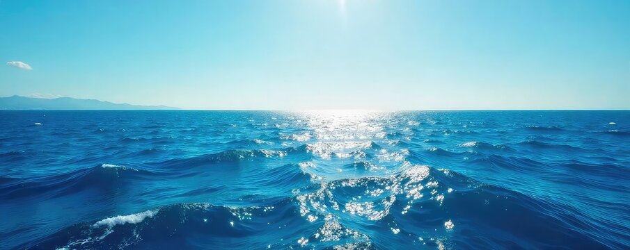 Vast, cerulean ocean stretching to the horizon, unbroken by land, sunlight shimmering on the waves  A breathtaking view of endless blue, capturing the immensity and mystery of the deep ,  world,  sky