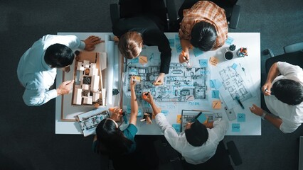 Time lapse of professional architect engineer team writing sticky notes and sticking note at house...