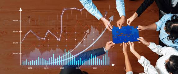 A diverse team collaborates in a corporate setting, analyzing graphs and charts, discussing strategies for growth and success through effective teamwork and communication. Scalp