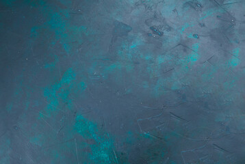 Abstract textured background with a cool color palette featuring subtle hints of teal and green against a dominant slate gray