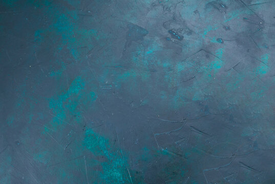 Abstract textured background with a cool color palette featuring subtle hints of teal and green against a dominant slate gray