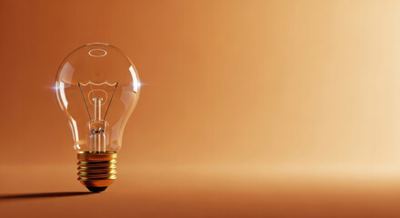 Clear glass light bulb standing upright on smooth gradient orange background, symbolizing creativity, innovation, and bright ideas in minimalistic and modern style
