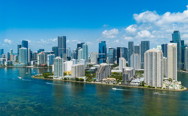 Obraz premium Aerial view of Brickell skyscrapers. Modern cityscape of downtown Miami. Panoramic Miamis skyline above the coastline. Brickell Key aerial view in Miami. Landscape of Miami. Miami Beach and Brickell.