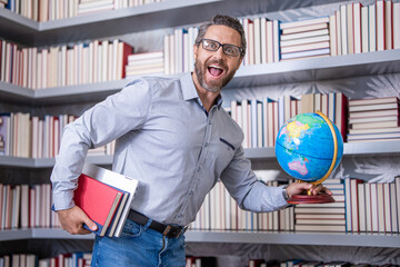 school teacher professor of geography in classroom hold globe and shre knowledge and education at teachers day