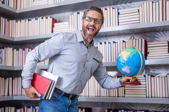 school teacher professor of geography in classroom hold globe and shre knowledge and education at teachers day
