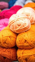 Piled yarn balls in orange, pink hues