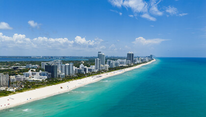 Drone aerial view of Miamis sandy beach. Miami coastline. Wide drone shot of Miami Beach and ocean...