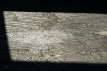 Sun light on floor with shadow. Bright light from window. Wood imitation. No people. Nobody. Indoor. Concept background. Black. Dark.