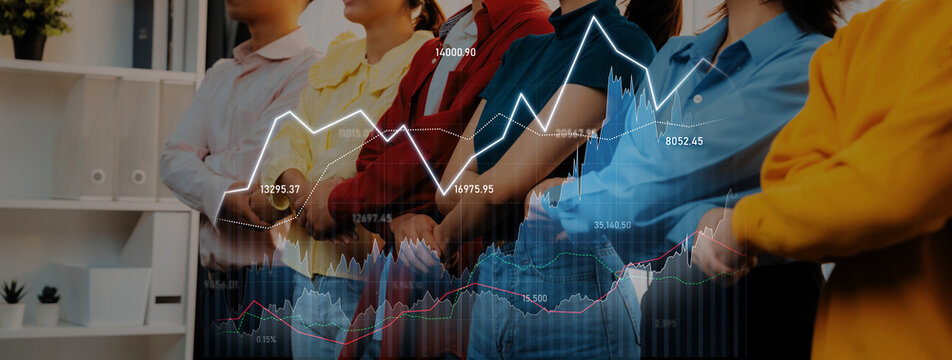 A diverse group of professionals stands together against a backdrop of a financial graph, symbolizing collaboration and market analysis in a modern office setting. Scalp - Powered by Adobe