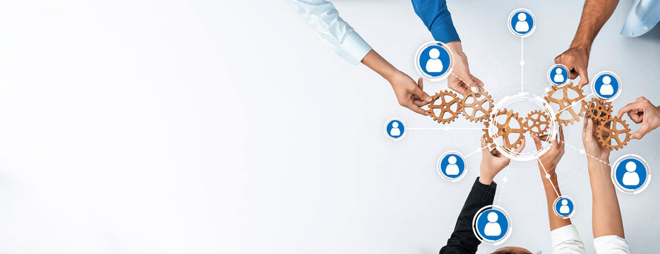 Visual representation of teamwork and collaboration with hands holding gears, showcasing networking and social connections in a business environment. Amity