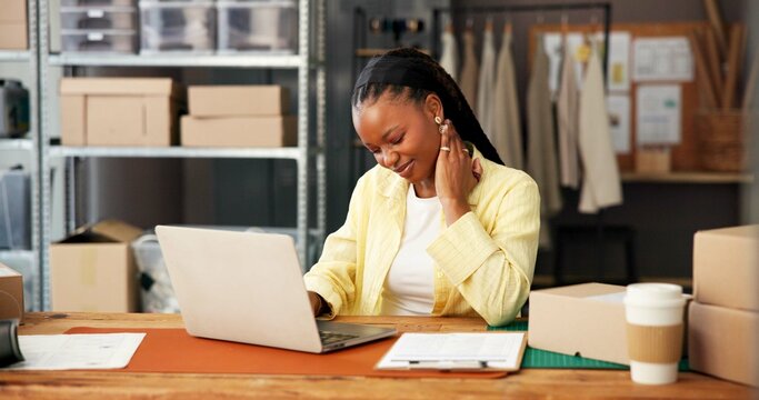 Woman, neck pain and logistics with laptop at startup, stress and massage for inflammation at warehouse. African person, logistics and pc with injury, frustrated or burnout with inventory management - Powered by Adobe