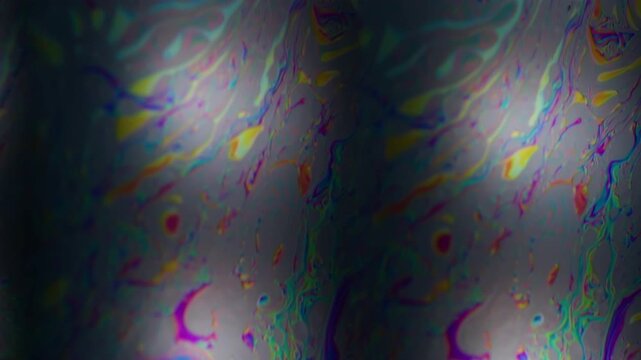 Hypnotic defocused stream. Gasoline surface. Multicolor art ink fluid duplicate flow on black liquid. Prism lens abstract background.