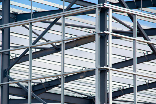 Close-up of steel frame framework of modern commercial building under construction