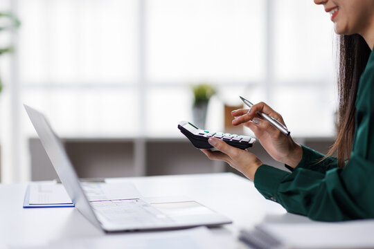 Asian business woman Auditor or internal revenue service staff checking annual financial statements company Audit  Accounting tax
