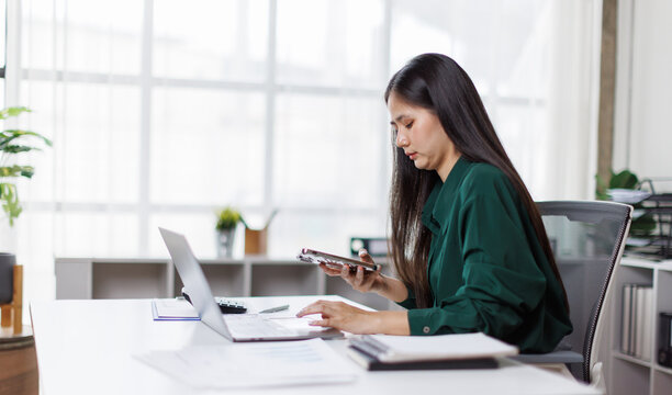 Asian business woman Auditor or internal revenue service staff checking annual financial statements company Audit  Accounting tax
