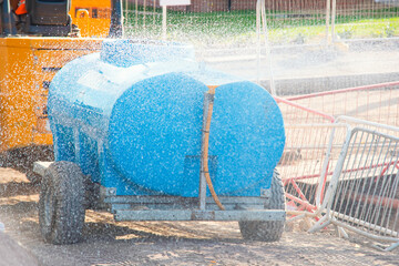 Construction site water spraying device used for dust control during hot summer days work