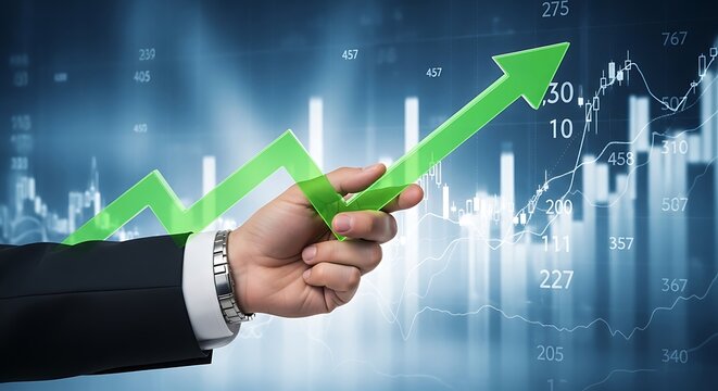 A hand holding a green arrow pointing up over a stock market chart - Powered by Adobe