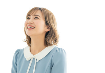 Joyful young asian woman looking up with a bright happy smile